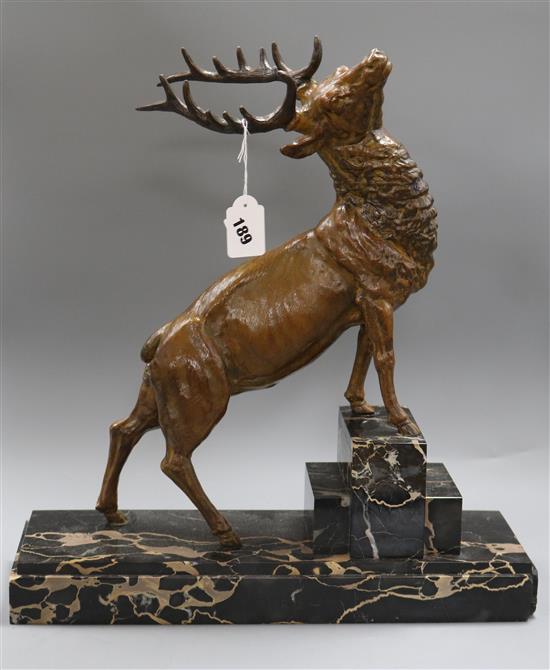 A Deco bronzed metal stag marked Omerth Length of base 44cm